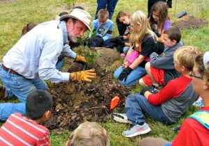 Foundation VA showing kids how to plant a tree