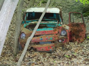Photo of rusted truck in the woods by J. Eric Smith